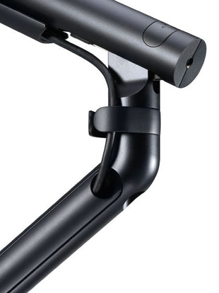 Seitenansicht eines weißen Flo-Monitorarms von CBS, die den großen Bewegungsspielraum zeigt.