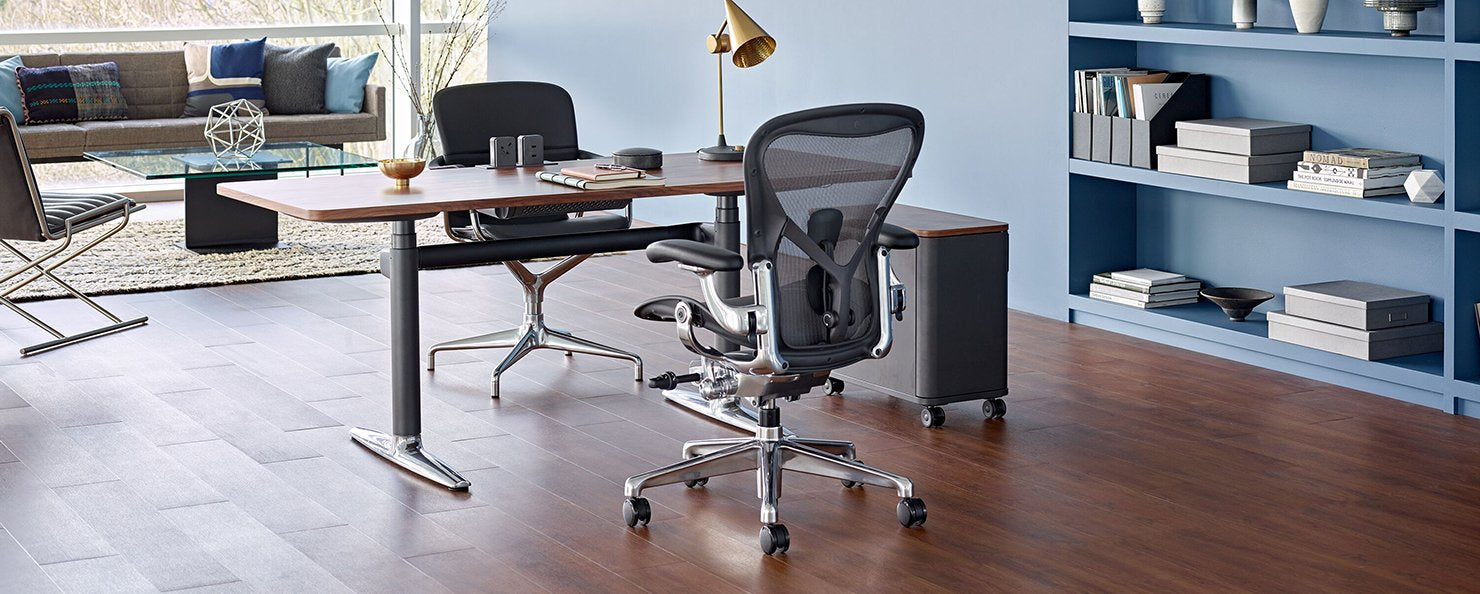 A graphite Aeron with a polished aluminium base in an home office setting